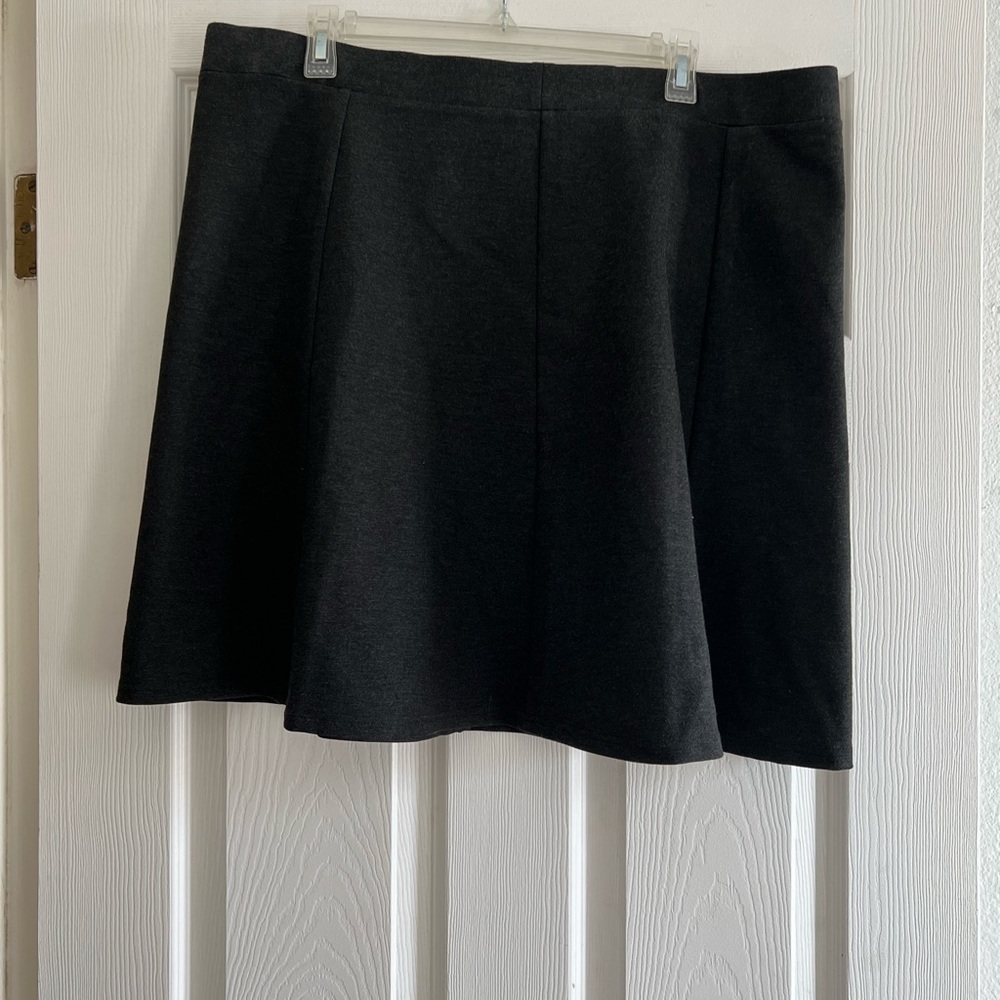 Gray skirt, worn a few times. Stretch and sits right above the knees.